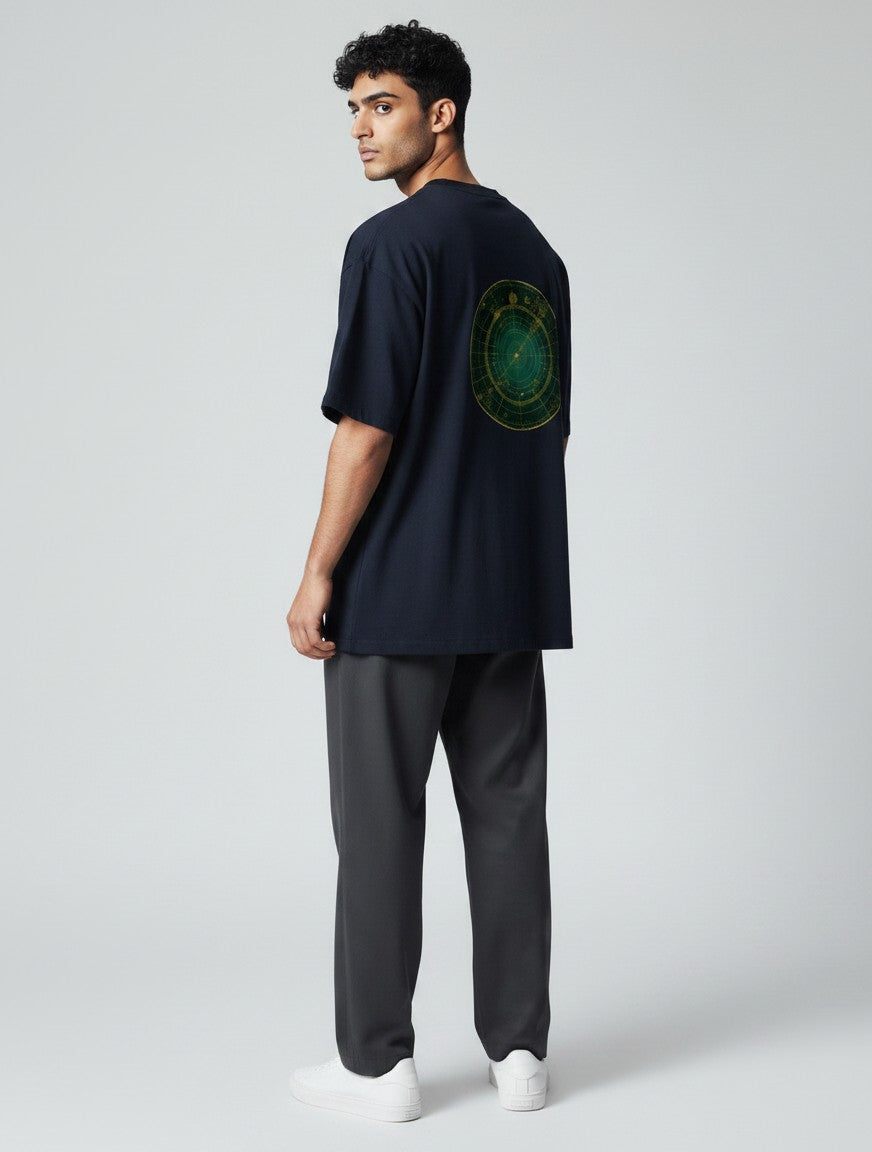 Born West navy blue oversized terry tee with a circular green and gold celestial map graphic on the back.