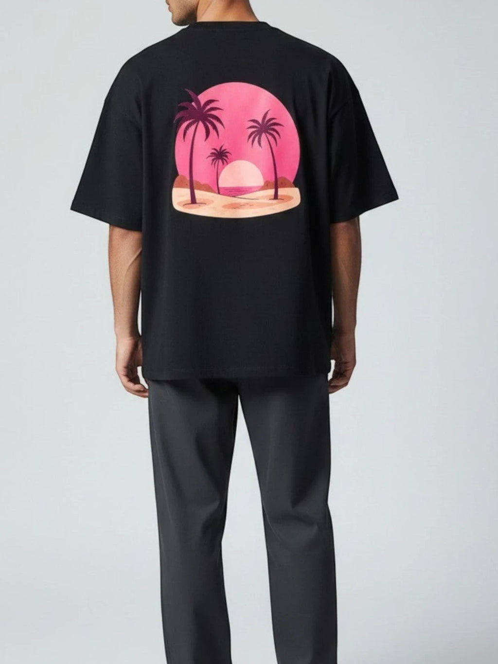 Born West black terry knit oversized tee with a vaporwave sunset and palm tree graphic on the back.