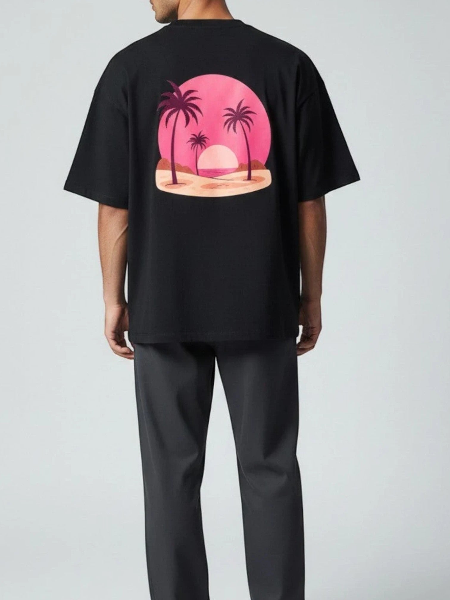 Born West black terry knit oversized tee with a vaporwave sunset and palm tree graphic on the back.