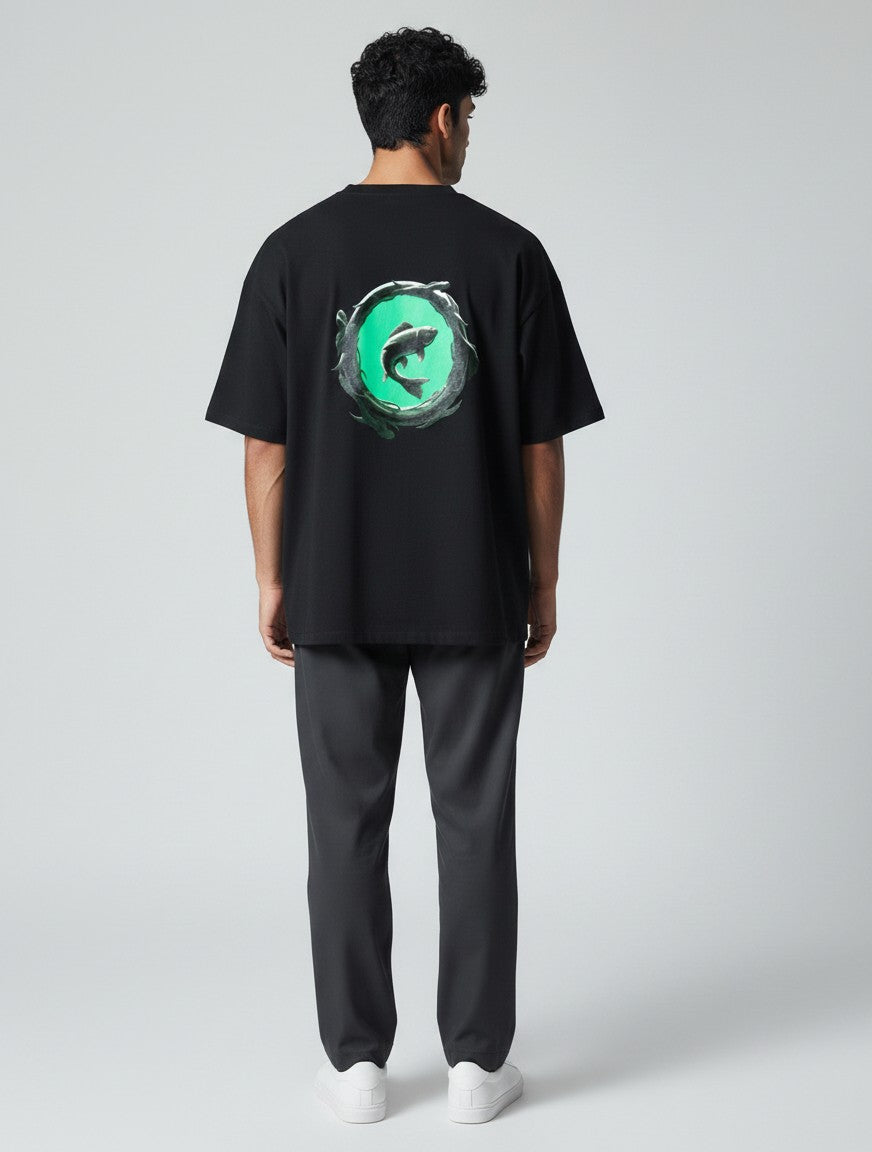 Born West black heavyweight terry-knit oversized tee with a metallic koi fish graphic on a teal background.