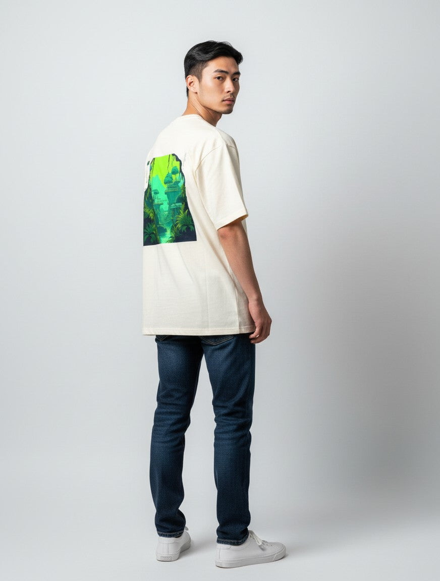 Born West cream oversized terry tee with a vibrant neon jungle landscape graphic on the back.