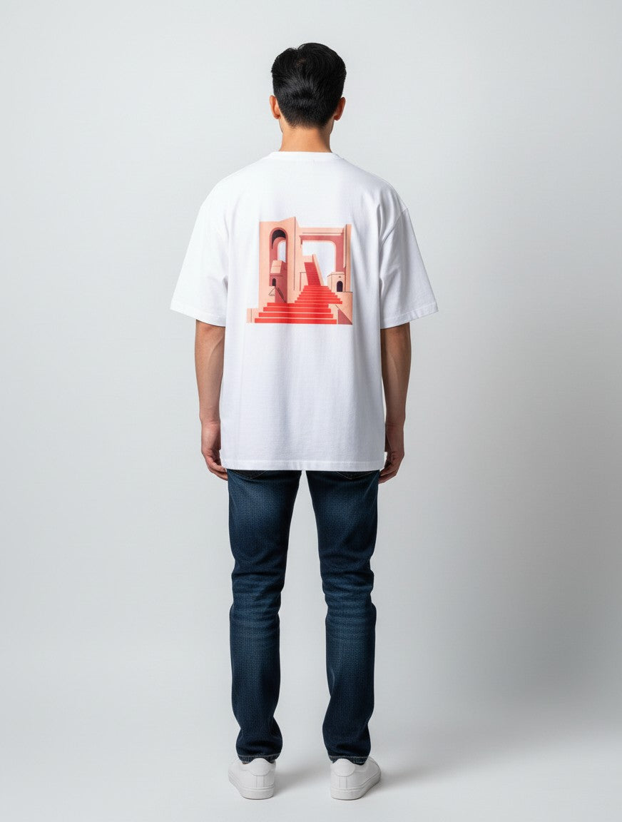 Born West white oversized terry tee with a graphic print of a geometric staircase design in red and peach.