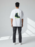 Born West white oversized terry knit t-shirt with a graphic print of a navy boot with electric lime accents.