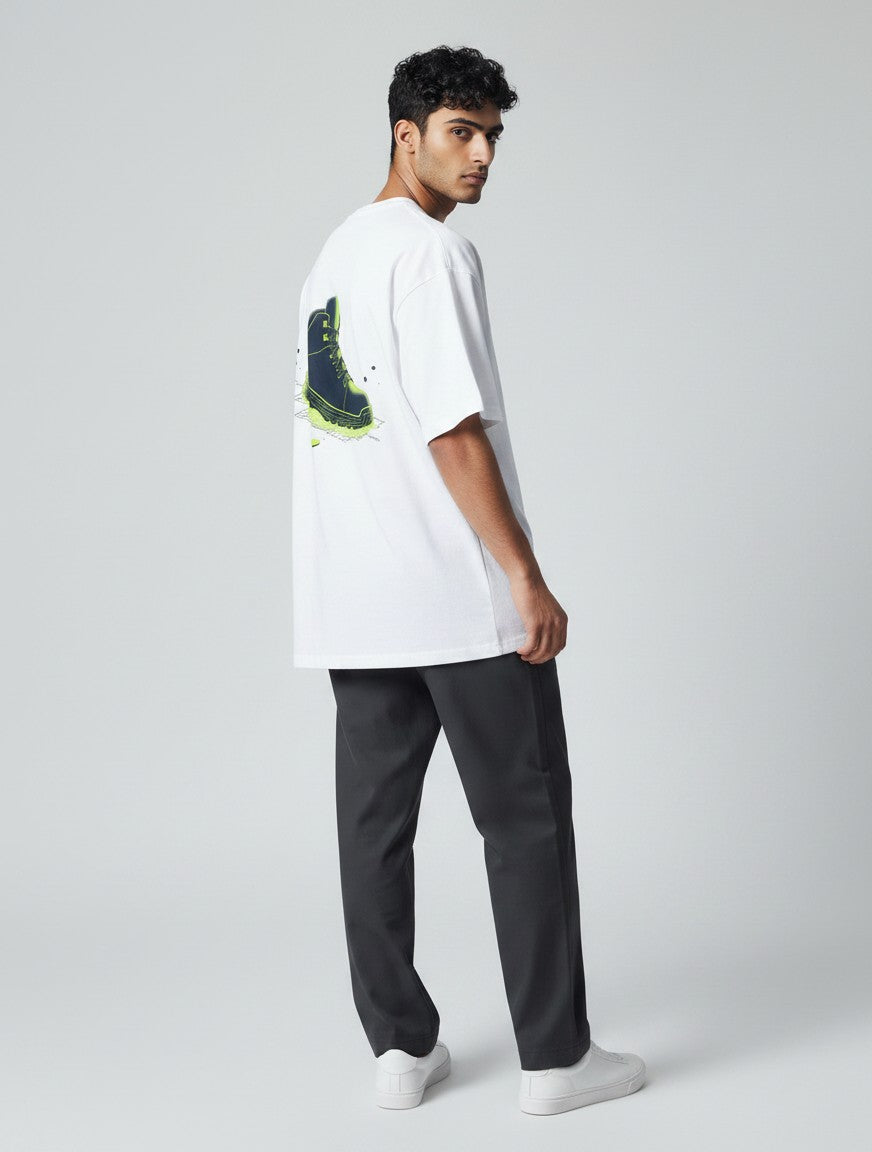 Born West white oversized terry knit t-shirt with a graphic print of a navy boot with electric lime accents.